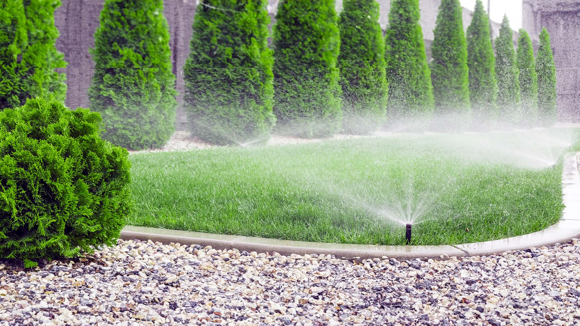 Sprinkler system watering grass