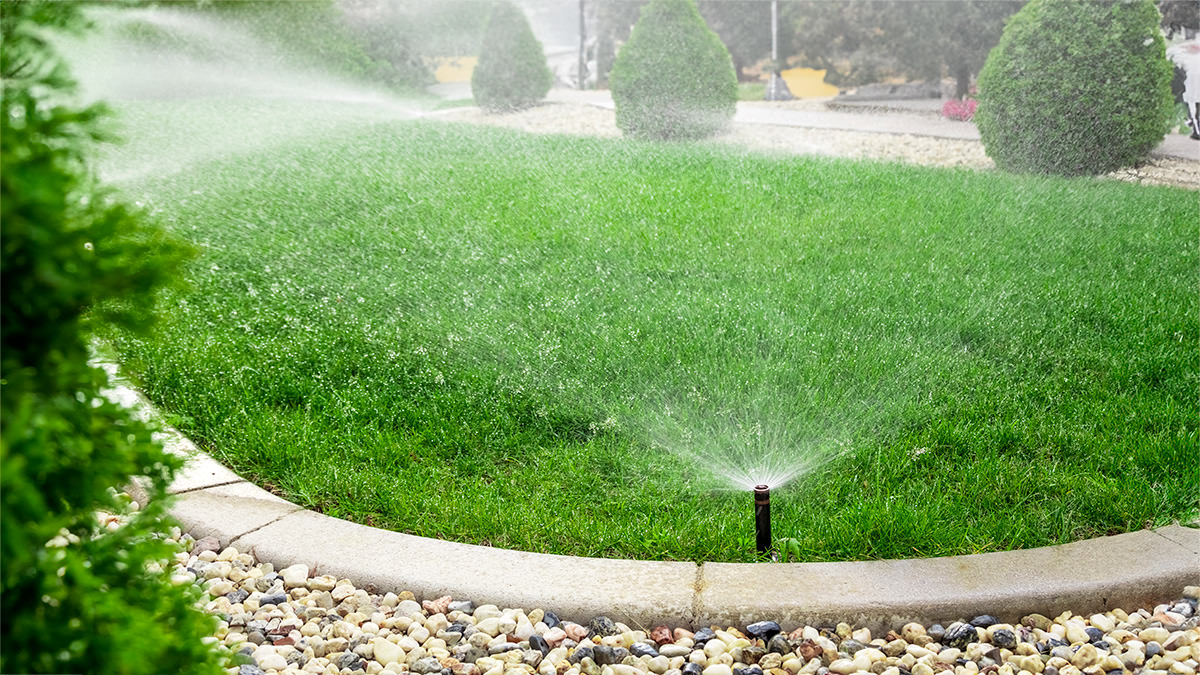 Sprinkler system watering a lawn