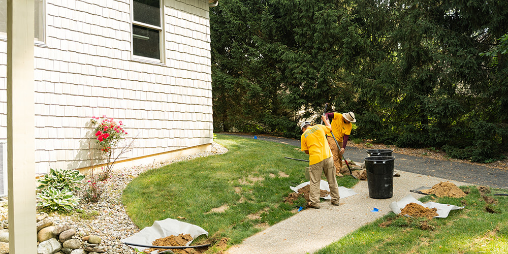 Request Your New Sprinkler System Consultation Today Estimator quoting a sprinkler installation