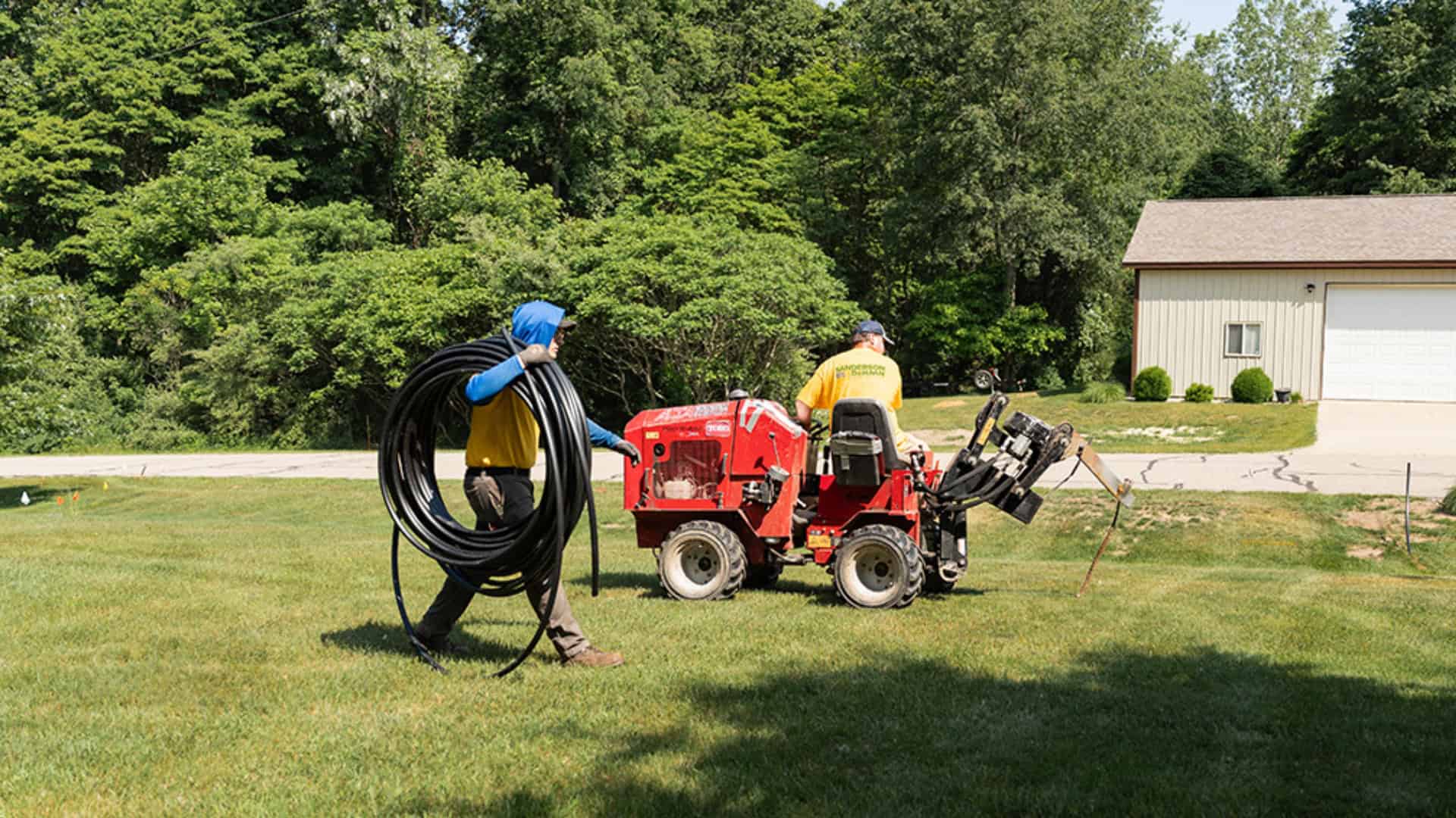 Michigan Irrigation System Installation Sanderson and DeHaan crew installing a lawn irrigation system in Michigan