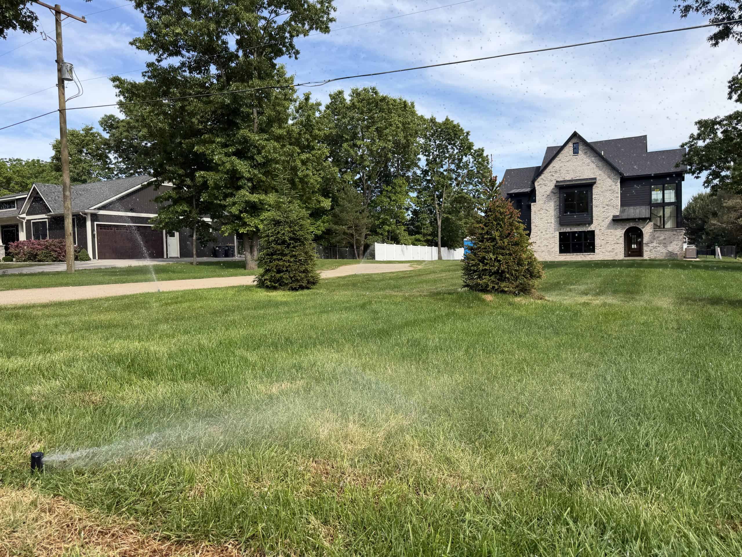 Sanderson and DeHaan crew installing a lawn irrigation system in Michigan